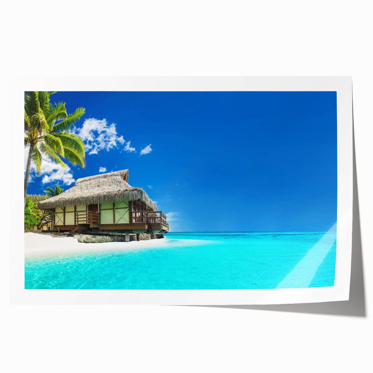 Vibrant beach landscape wall art print showcasing serene ocean waves and golden sand, rolled for easy shipping and display in a modern home decor setting.