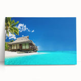 Stretched canvas wall art featuring a serene beach landscape with vibrant blue skies and gentle waves, perfect for adding a calming touch to home decor.