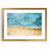 Elegant gold-framed wall art featuring a serene beach landscape design, complete with a white mat for added sophistication. Perfect for enhancing home decor with a coastal vibe.