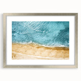 Framed wall art collection showcasing a serene beach landscape design, featuring a silver mat and modern frame, ideal for home decor and coastal themes.