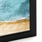 Close-up of a framed canvas wall art piece depicting a serene beach landscape, showcasing vibrant colors and textured details, perfect for modern decor.