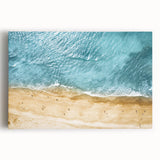Stretched canvas wall art showcasing a serene beach landscape with vibrant blue skies and golden sands, perfect for enhancing home decor and creating a calming atmosphere.