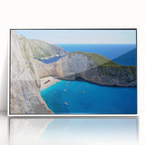 Framed wall art collection showcasing a serene beach landscape with vibrant colors, set in a sleek white frame, ideal for home decor enhancement.