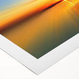 Vibrant rolled canvas wall art showcasing a serene beach landscape with soft waves and a pastel sunset, ideal for coastal décor and relaxation themes.
