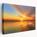 Stretched canvas wall art featuring a vibrant beach landscape design, showcasing vivid blues and sandy tones, perfect for coastal decor. The side view highlights the canvas texture and framing, ideal for enhancing any living space with a serene seaside atmosphere.