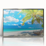 Framed wall art featuring a serene beach landscape with soothing blue and sandy hues, designed in a sleek silver frame, ideal for coastal-themed decor.