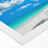 Vibrant rolled canvas wall art showcasing a serene beach landscape with soft blue skies and gentle waves, perfect for coastal home decor and relaxation themes.