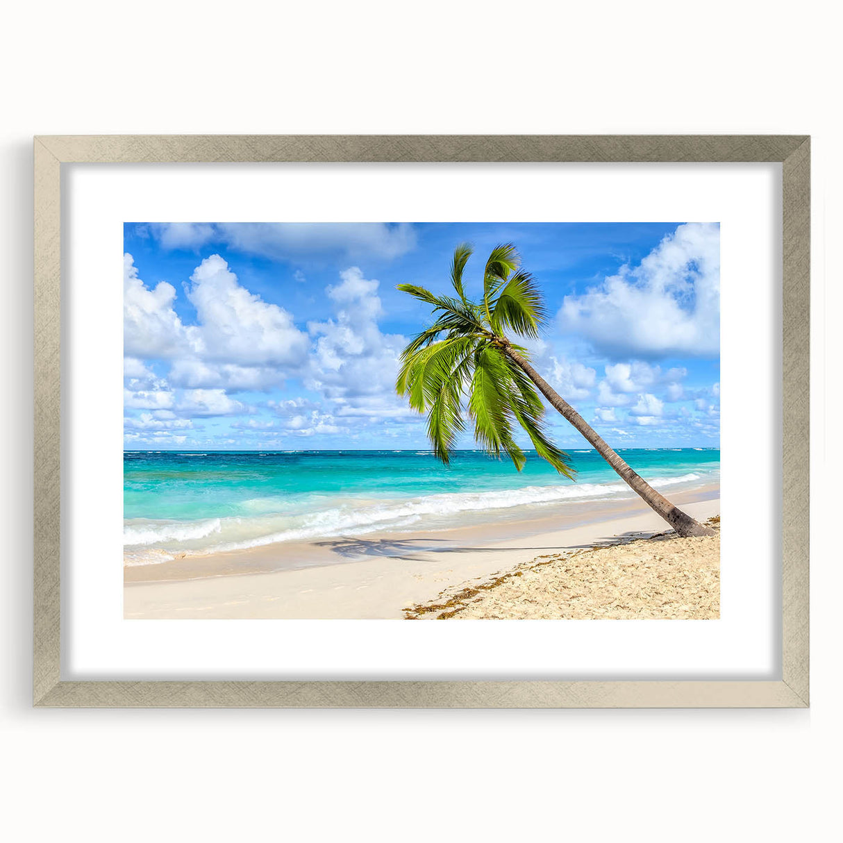 Framed wall art showcasing a serene beach landscape design, featuring soft blue and beige tones, elegantly matted with a silver frame for a sophisticated look. Perfect for home decor enthusiasts seeking coastal aesthetics.