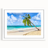 Framed wall art showcasing a serene beach landscape, featuring soft pastel colors and a white mat, perfect for enhancing coastal-themed home decor.
