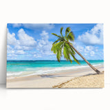Stretched canvas wall art showcasing a serene beach landscape with vibrant blue skies and gentle waves, perfect for coastal-themed decor or relaxation spaces.