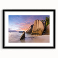 Framed wall art featuring a serene beach landscape design with vibrant colors, set in a sleek black frame with a white mat, ideal for home decor enhancement.