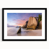 Framed wall art featuring a serene beach landscape design with vibrant colors, set in a sleek black frame with a white mat, ideal for home decor enhancement.