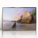 Framed acrylic wall art displaying a serene beach landscape, featuring soft blue and sandy hues, ideal for coastal-themed decor and modern interiors.