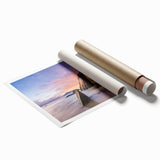 Rolled print of a serene beach landscape featuring vibrant blue skies and soft sandy shores, ideal for home decor, showcasing tranquility and natural beauty.