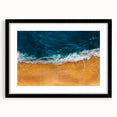 Framed wall art featuring a serene beach landscape with vibrant colors, set in a sleek black frame and mat, perfect for home decor and coastal themes.