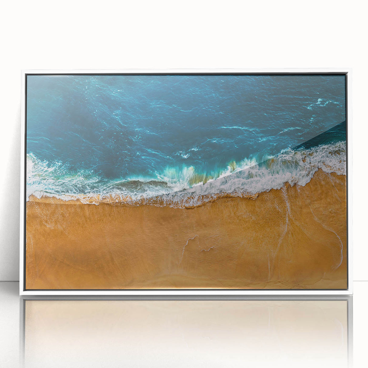Framed acrylic wall art showcasing a serene beach landscape with vibrant colors, perfect for coastal-themed decor. White frame accentuates the art's beauty.