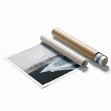 Rolled print of a serene beach landscape, showcasing vibrant colors and tranquil waves, designed for wall art collection, packaged securely in cardboard.