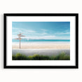 Framed wall art collection showcasing a serene beach landscape with vibrant colors, featuring a sleek black mat and frame, ideal for coastal-themed decor.