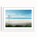 Framed wall art featuring a serene beach landscape design with a white mat, showcasing soft blue and sandy colors, ideal for home decor and relaxation themes.