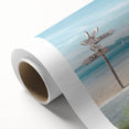 Rolled canvas artwork showcasing a serene beach landscape with soft pastel colors, ideal for home decor. Comes in a protective cardboard tube for easy transport.