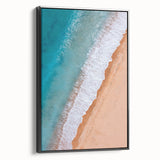 Framed canvas wall art showcasing a serene beach landscape with vibrant colors, black frame emphasizing the artwork's beauty, perfect for home decor.
