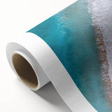 Rolled canvas depicting a serene beach landscape with vibrant colors, ideal for home decor, showcasing waves, sandy shores, and a tranquil sky. Perfect for coastal-inspired interiors.