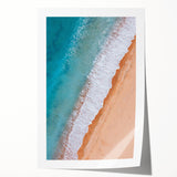 Rolled print of a serene beach landscape featuring soft blue skies and gentle waves, ideal for home decor, showcasing tranquil coastal vibes and artistic elegance.
