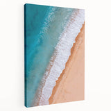 Stretched canvas wall art showcasing a serene beach landscape design, featuring vibrant blue ocean waves and soft beige sand, ideal for coastal home decor.