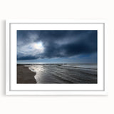 Framed wall art design showcasing a serene beach landscape with soft, calming colors, elegantly matted in white, ideal for home decor and relaxation.