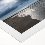 Vibrant rolled canvas wall art showcasing a serene beach landscape at sunset, featuring soft pastel colors and gentle waves, perfect for home decor.