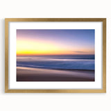 Elegant gold-framed landscape wall art featuring a serene beach scene, complete with soft waves and a vibrant sunset, perfect for home decor enhancement.