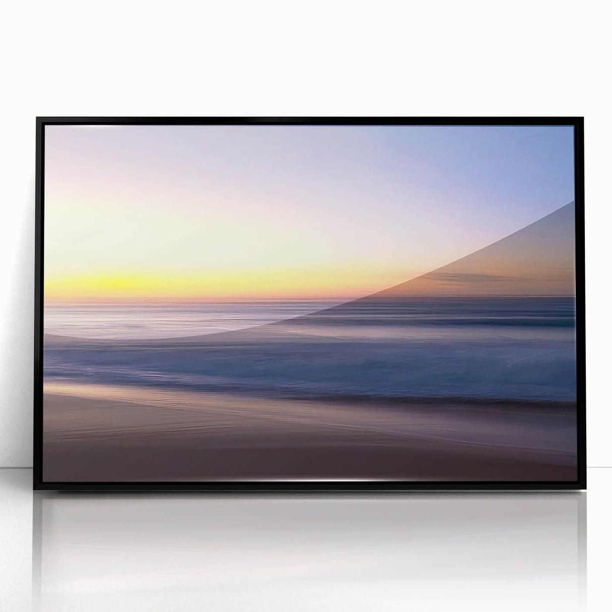 Framed wall art collection displaying a vibrant beach landscape scene with blue skies and golden sand, set in a sleek black frame for modern decor.