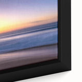 Framed canvas wall art showcasing a serene beach landscape with vibrant blues and sandy tones, perfect for enhancing living spaces and evoking a calming atmosphere.
