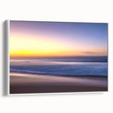 Framed canvas wall art showcasing a serene beach landscape with vibrant colors, displayed against a white background, ideal for coastal-themed decor.