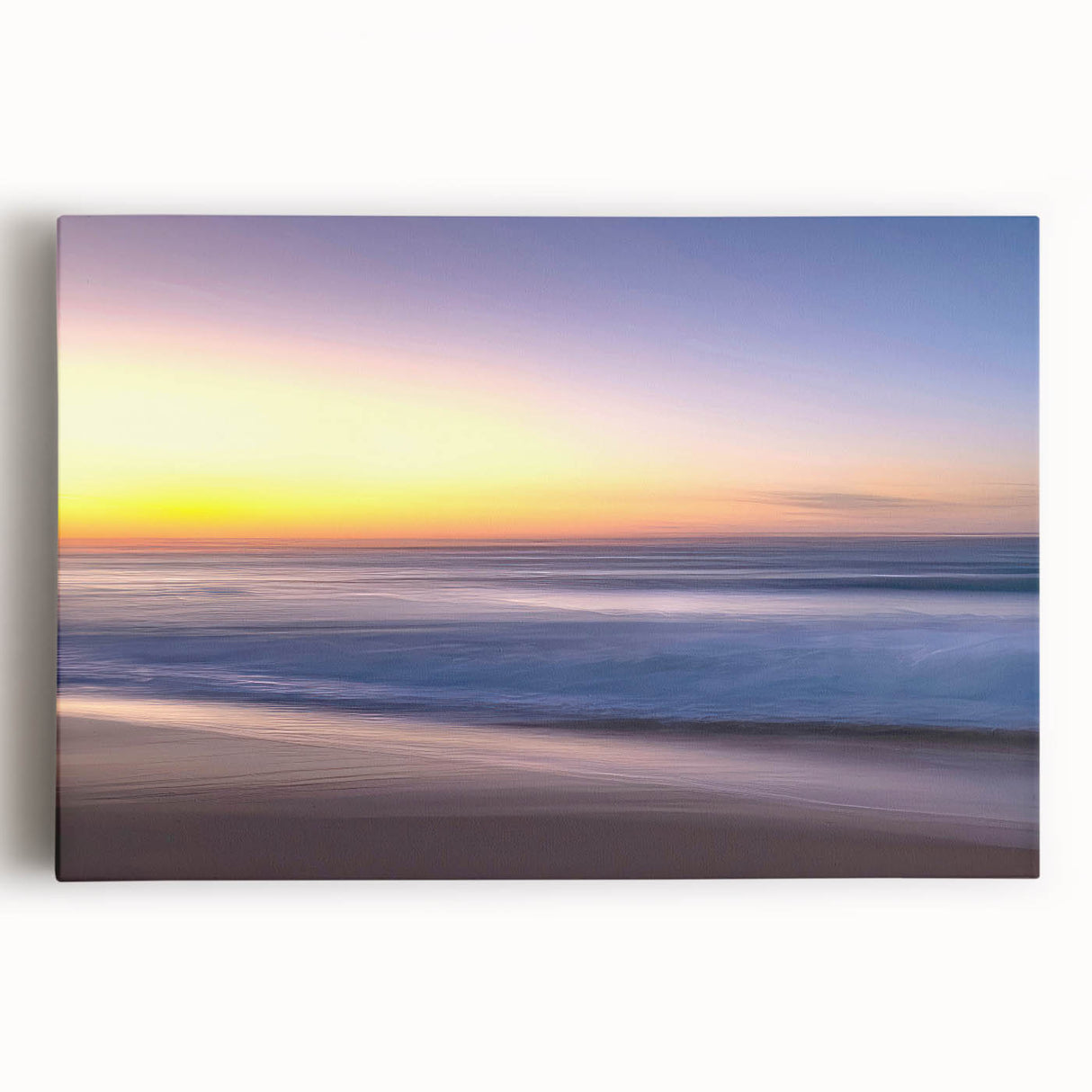 Stretched canvas artwork showcasing a serene beach landscape with vibrant colors and gentle waves, ideal for home decor or coastal-themed interiors. Perfect for creating a tranquil atmosphere.