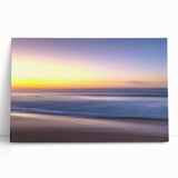 Stretched canvas wall art featuring a serene beach landscape with vibrant colors, ideal for home decor. The artwork leans against a neutral wall, enhancing its visual appeal.
