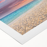 Vibrant rolled canvas wall art showcasing a serene beach landscape at sunset with gentle waves and colorful skies, ideal for home decor and relaxation.