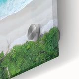 Close-up of a vibrant acrylic glass wall art piece showcasing a serene beach landscape design, featuring soft waves and a colorful sunset, perfect for home decor.