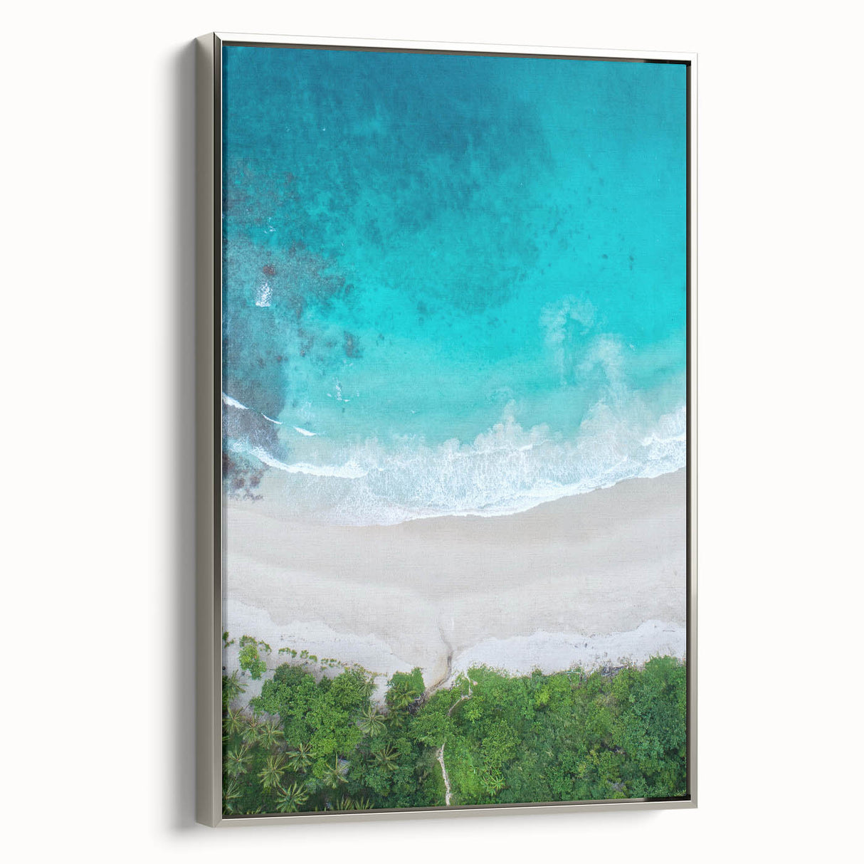 Framed canvas wall art featuring a serene beach landscape with vibrant colors, silver frame, perfect for home decor, adding a coastal vibe to any room.