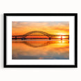Black-framed wall art featuring a serene landscape with bridges, ideal for home decor. The piece showcases vibrant colors and intricate details, enhancing any room's aesthetic.