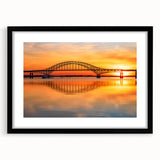 Black-framed wall art featuring a serene landscape with bridges, ideal for home decor. The piece showcases vibrant colors and intricate details, enhancing any room's aesthetic.