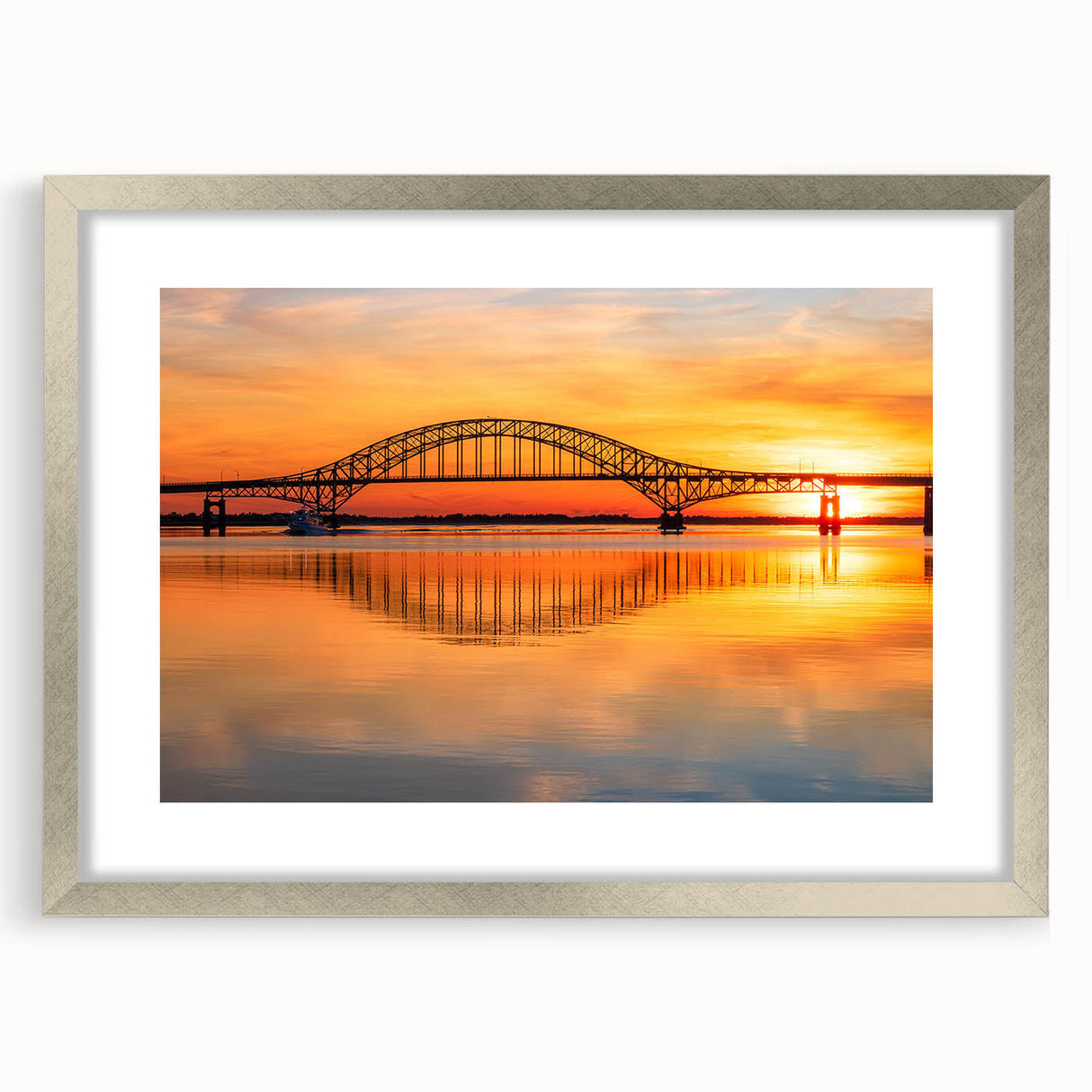 Elegant silver-framed landscape wall art featuring a scenic bridge design, perfect for modern home decor. The artwork is complemented by a white mat, enhancing its visual appeal. Ideal for adding a touch of sophistication to living spaces or office environments.