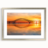 Elegant silver-framed landscape wall art featuring a scenic bridge design, perfect for modern home decor. The artwork is complemented by a white mat, enhancing its visual appeal. Ideal for adding a touch of sophistication to living spaces or office environments.