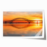 Rolled art print showcasing a vibrant landscape with a modern bridge design, featuring rich colors and intricate details, perfect for home decor enhancement.