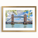 Elegant gold-framed wall art featuring a serene landscape with a bridge, ideal for home decor. The mat adds a refined touch, enhancing any room's ambiance.