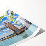 Rolled print showcasing a serene landscape bridge design, featuring vibrant colors and intricate details, perfect for home decor or art enthusiasts. Packaged securely in a cardboard tube for safe shipping.