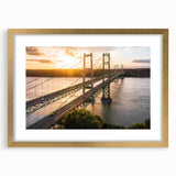 Elegant gold-framed wall art showcasing a scenic landscape with a bridge, complemented by a white mat for a sophisticated presentation, perfect for home decor.