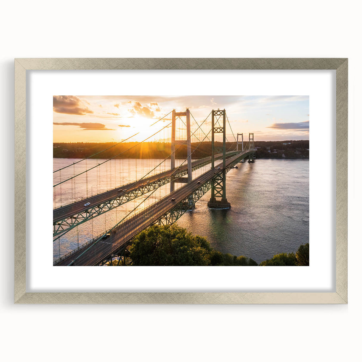 Framed wall art collection showcasing a serene landscape with a bridge, featuring a silver mat and sleek frame, perfect for enhancing home decor elegance.