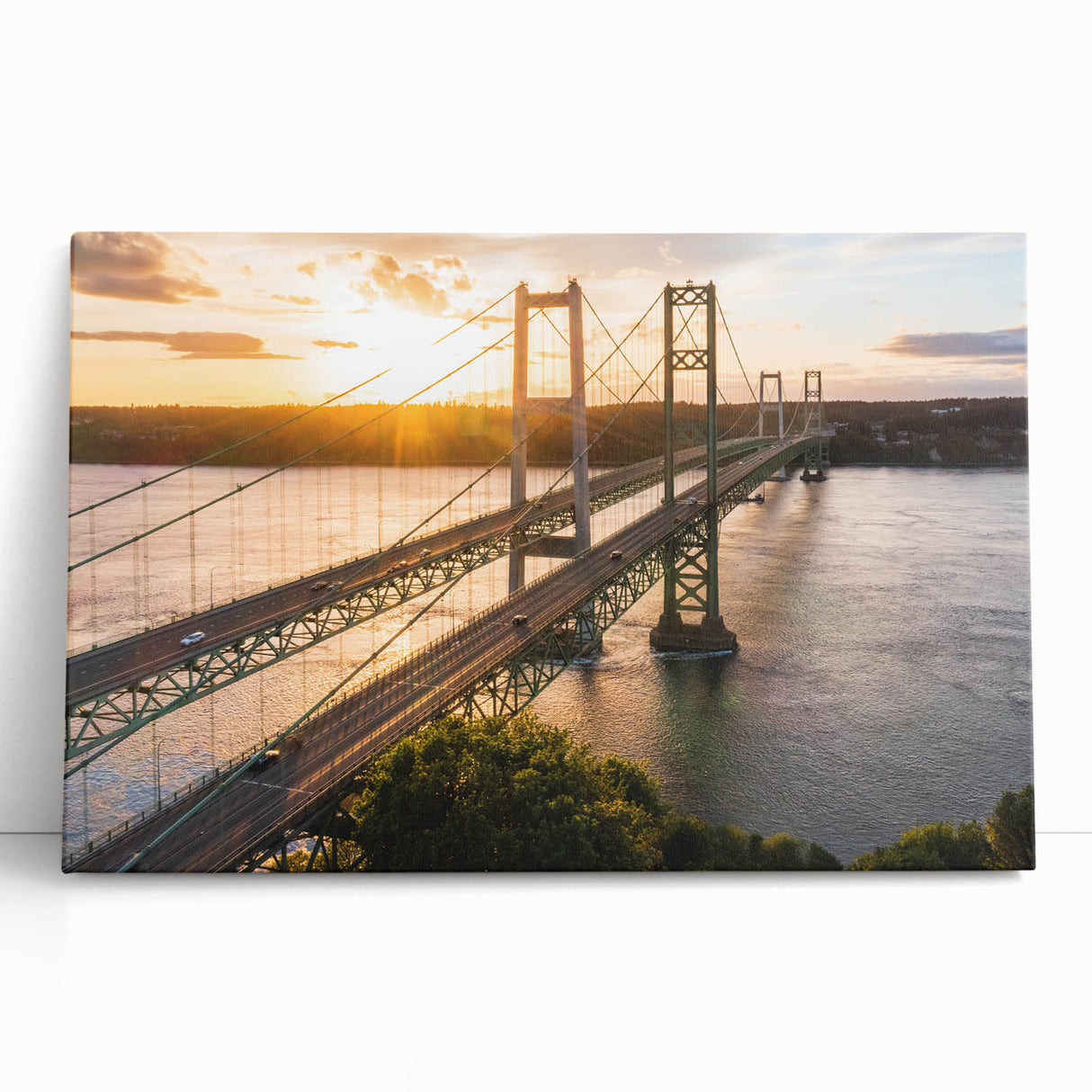 Stretched canvas artwork depicting a serene landscape with a bridge over a tranquil river, showcasing vibrant colors and intricate details, perfect for home decor.