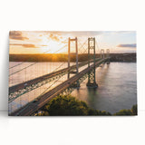 Stretched canvas artwork depicting a serene landscape with a bridge over a tranquil river, showcasing vibrant colors and intricate details, perfect for home decor.